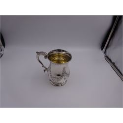 Victorian silver mug, of bellied form with chased foliate swags to body and acanthus capped scroll handle, upon a stepped circular foot, hallmarked Horace Woodward & Co, Birmingham 1879, H12.5cm, approximate weight 6.25 ozt (294.6 grams)