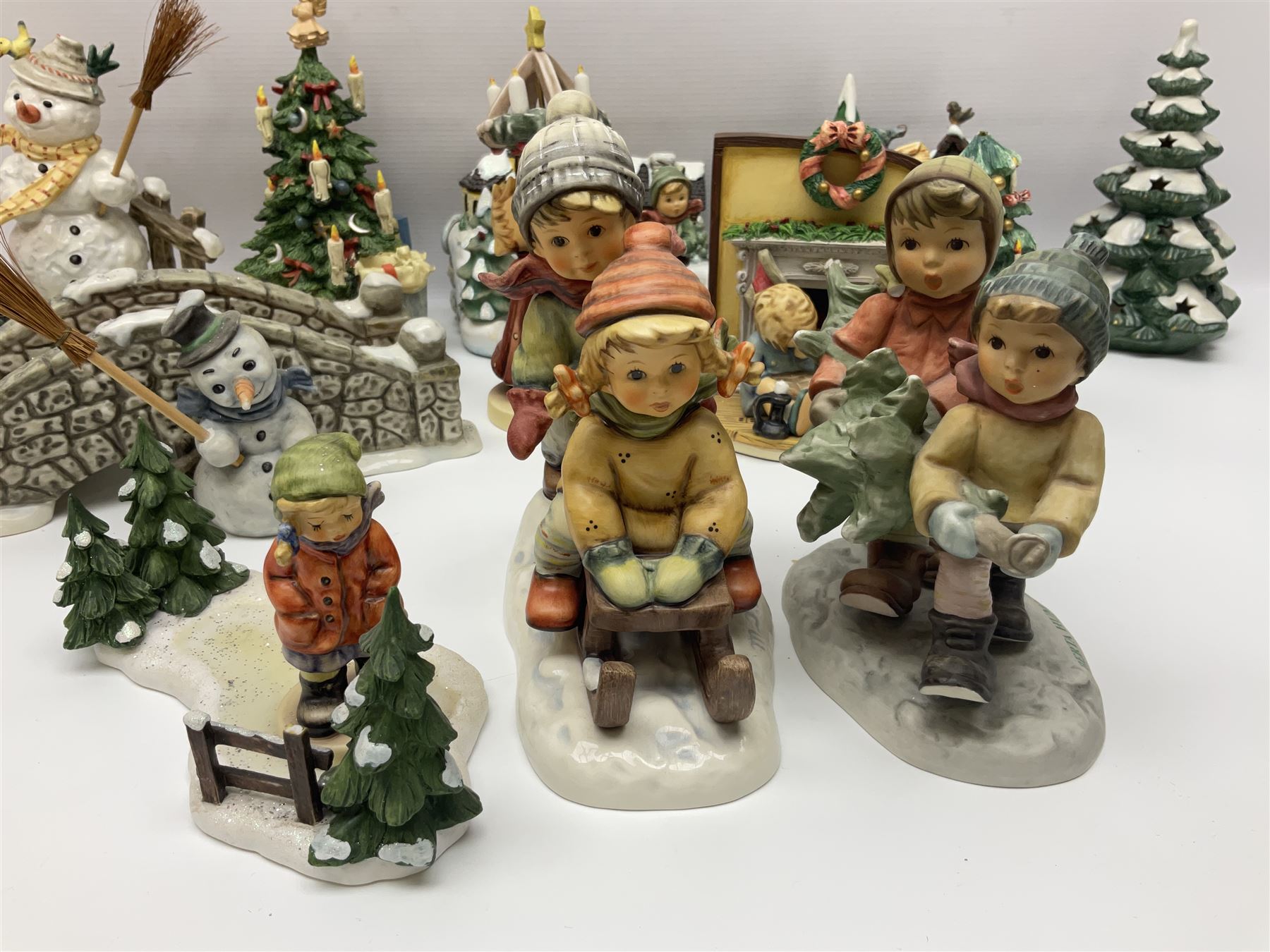 Large collection of Christmas themed Hummel figures and Hummel scapes by Goebel, to include Winter Friend, Making New Friends, Tree Trimming Time, Winter Adventure etc