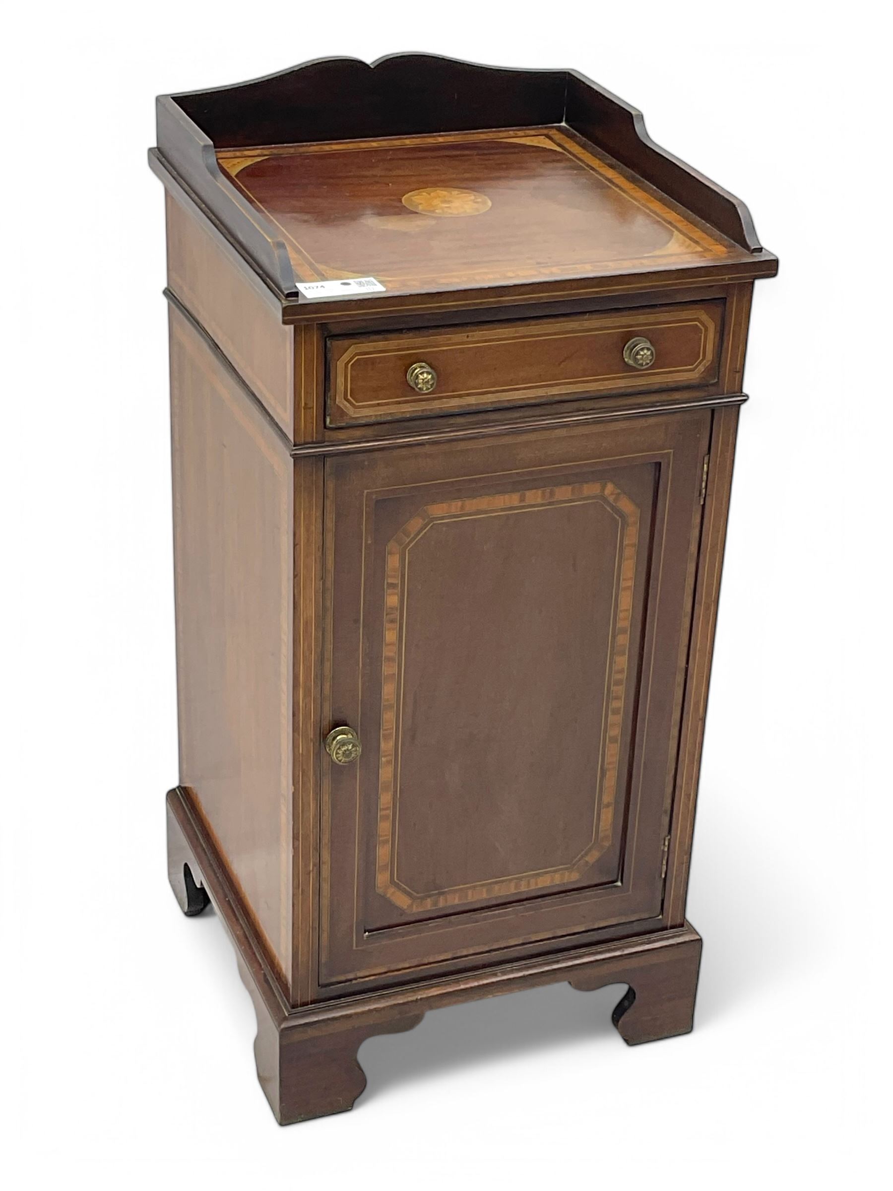Edwardian mahogany inlaid bedside cabinet, inlaid top with gallery above, single drawer with button handles and single shelf cupboard, on scroll carved bracket feet