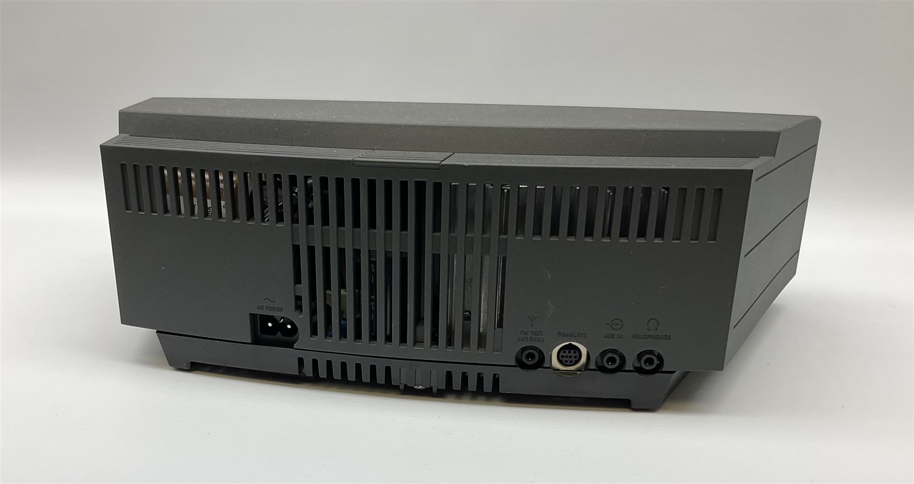 A Bose Wave music system, model AWRCC5, with remote control. 