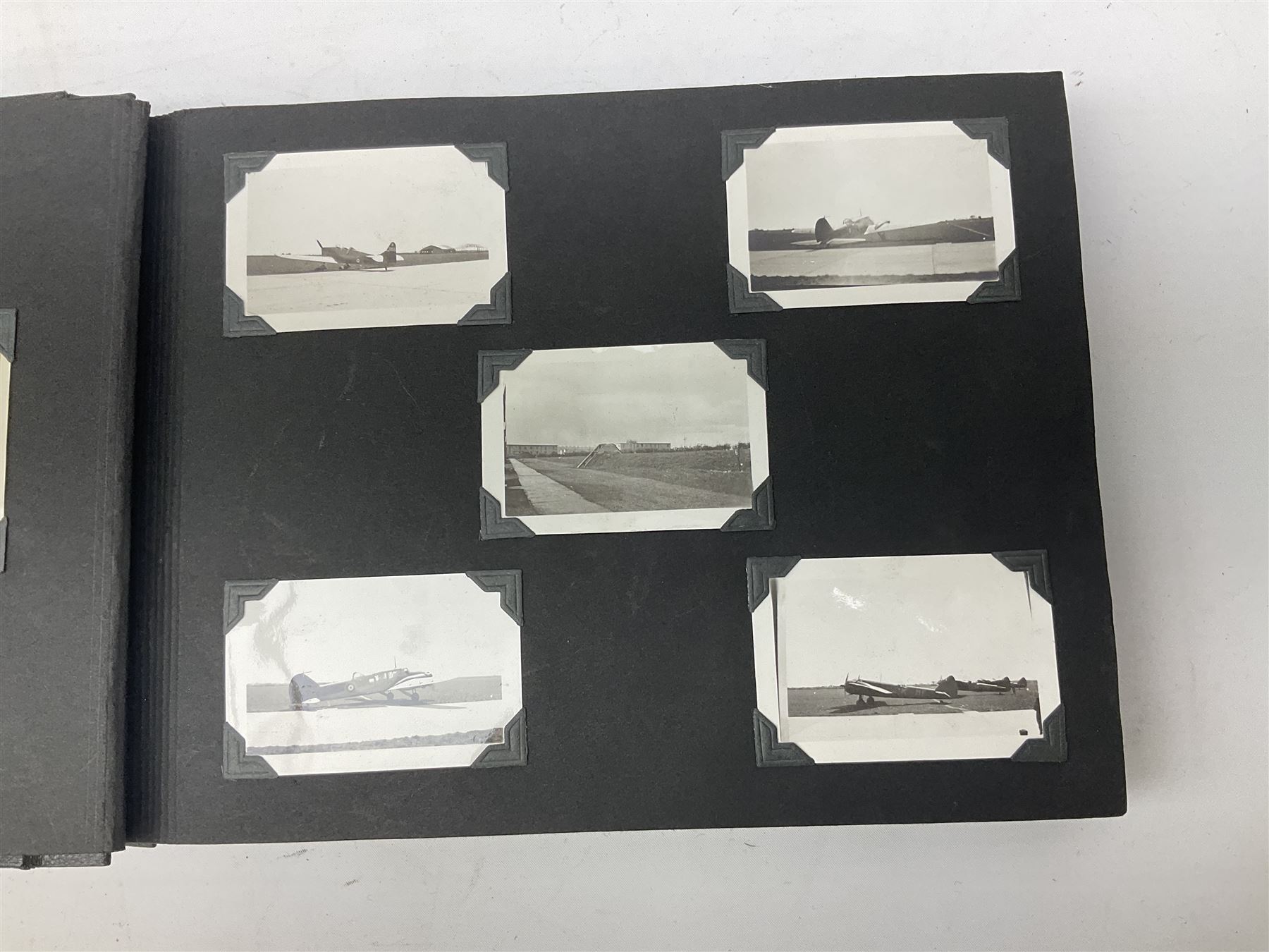 144 Squadron RAF - album containing over one hundred photographs and postcards of varying sizes including group shots, aircraft on the ground and in the air, German aircraft, crashes etc; sizes from 3.5 x 6cm to 16 x 21cm; and quantity of modern reference material
