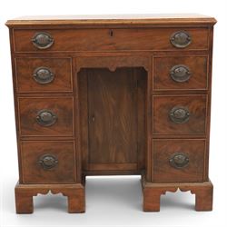 Early 20th century Georgian design figured walnut kneehole desk, rectangular moulded top over one long frieze drawer, kneehole recess with cupboard and drawer above, flanked by six short drawers with oval pressed brass handle plates, moulded plinth base on bracket feet
