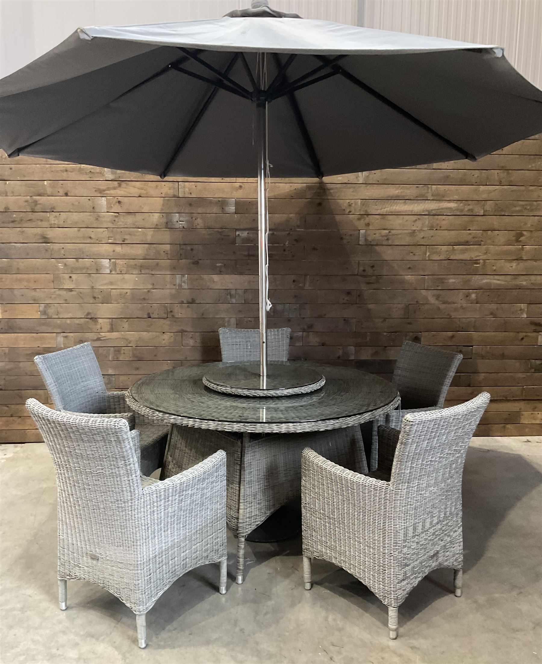 LeisureGrow circular rattan garden table, with lazy Susan, five armchairs with cushions, parasol and weighted base, with glass tops