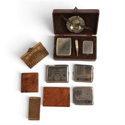 Three cigarette cases, modelled as bank notes, together with a smokers set including ashtray, cigarette case, ligher and cigarette holder, cased and other cigarette holders 