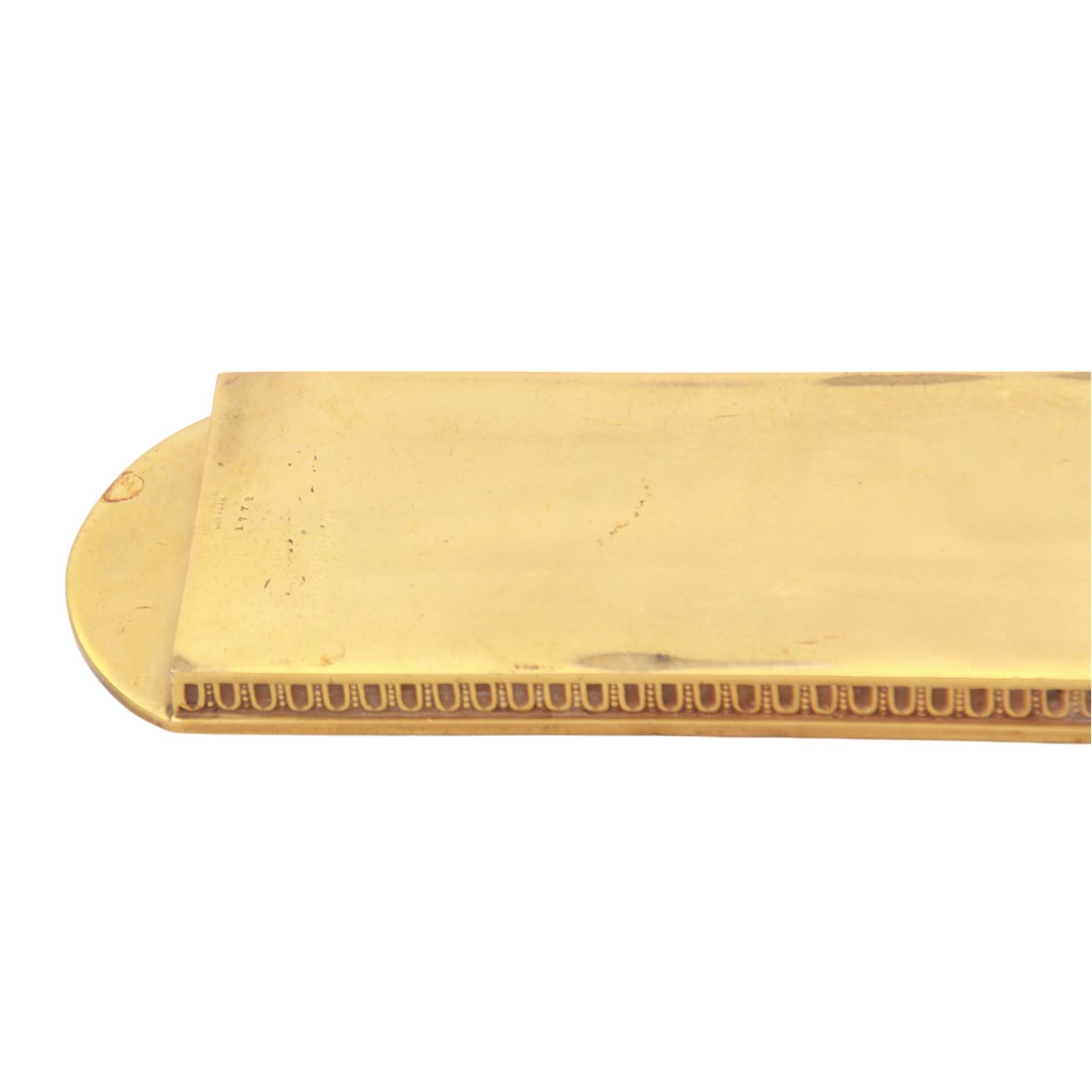 Early 20th century Tiffany & Co three piece gilt bronze Adam pattern desk tray, of oblong form with three divisions, decorated with patera and husk swags, stamped beneath Tiffany Studios New York, inkwell H6.5cm W10.5cm, tray W24.5cm
