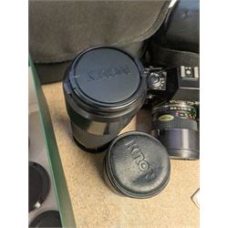 Contax SLR camera with a Yashica ML Zoom 42-75mm 1:3.5-4.5 lens, in case with accessories, together with a Yashica FX-D Quartz SLR camera with a Carl Zeiss Planar 1.7/50 lens, with filters, instruction booklets and other accessories