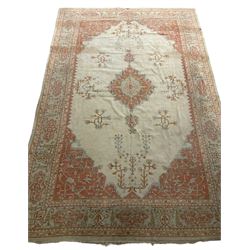 Large Persian pale sage ground carpet, the field decorated with central geometric medallion and tree of life motifs, the border with repeating geometric design decorated with stylised plant motifs