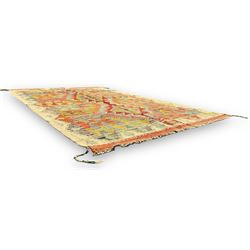 Afghan Chobi Kilim ivory ground rug, central geometric design consisting of stacked lozenge medallions in shades of red, green, and blue, flanked by multicoloured triangular motifs, guarded by zigzag patterns in contrasting tones