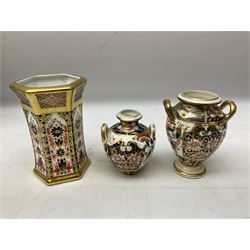 Group of Royal Crown Derby decorated in Imari 1128 pattern, comprising hexagonal vase, trinket dish and plate, together with two early 19th century Derby Imari pattern vases of baluster form and three Victorian Imari plates 