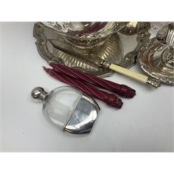 Quantity of silver plate, to include part fluted punch bowl with embossed floral decoration, pair of glass mounted candle sticks with etched grape vine decoration, sauce boat, salver, glass hip flask etc, together with a pair of copper frying pans 
