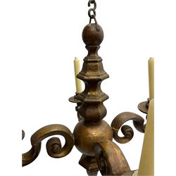 18th century giltwood chandelier, faceted and moulded extending stem with a globular centre, four extending branches of scrolled form with candle sconces, on wrought metal link chain