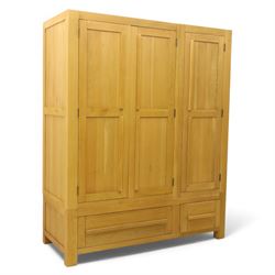 Modern light oak triple wardrobe,  three panel doors with integrated handles enclosing ful...