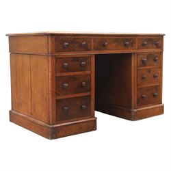 Victorian mahogany writing desk, featuring inset tooled red leather top, raised on two ped...
