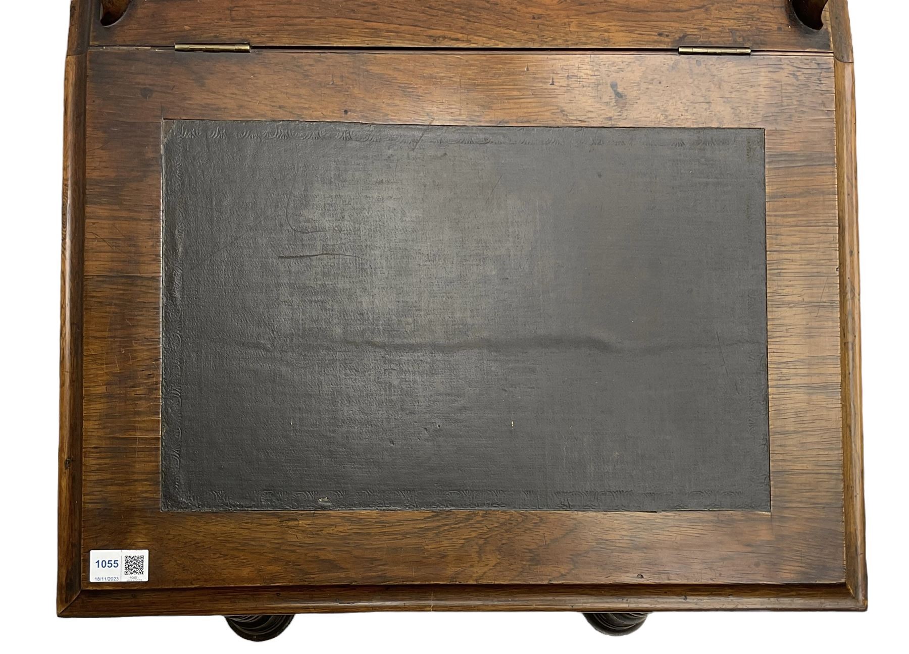 Victorian walnut Davenport, hinged sloping top with inset leather writing surface, enclosing satinwood lined interior with two drawers over faux drawer, fitted with inkwell drawer and pen compartment to the side over four drawers with an opposing false set, raised on spiral turned supports united by a shaped platform base