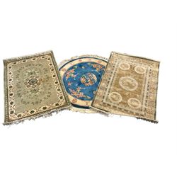 Three Chinese washed woollen rugs - circular blue ground decorated with dragons (D160cm), rectangular light green rug (185cm x 123cm), and a rectangular green rug (185cm x 123cm)
