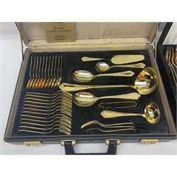 Bestecke Solingen canteen of gold plated cutlery for twelve place settings, including ladle, cake slice and serving spoons, contained within a briefcase, together with a matching set twelve of Bestecke Solingen gold plated fish knives and forks, in fitted case 
