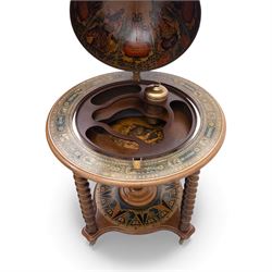 20th century Italian reproduction globe drinks table, the cartographic sphere decorated with Renaissance-style map scenes, hinged upper section enclosing bottle storage, with printed zodiac and calendar ring to the top, on spiral-turned legs joined by a compass rose undertier, brass castors below