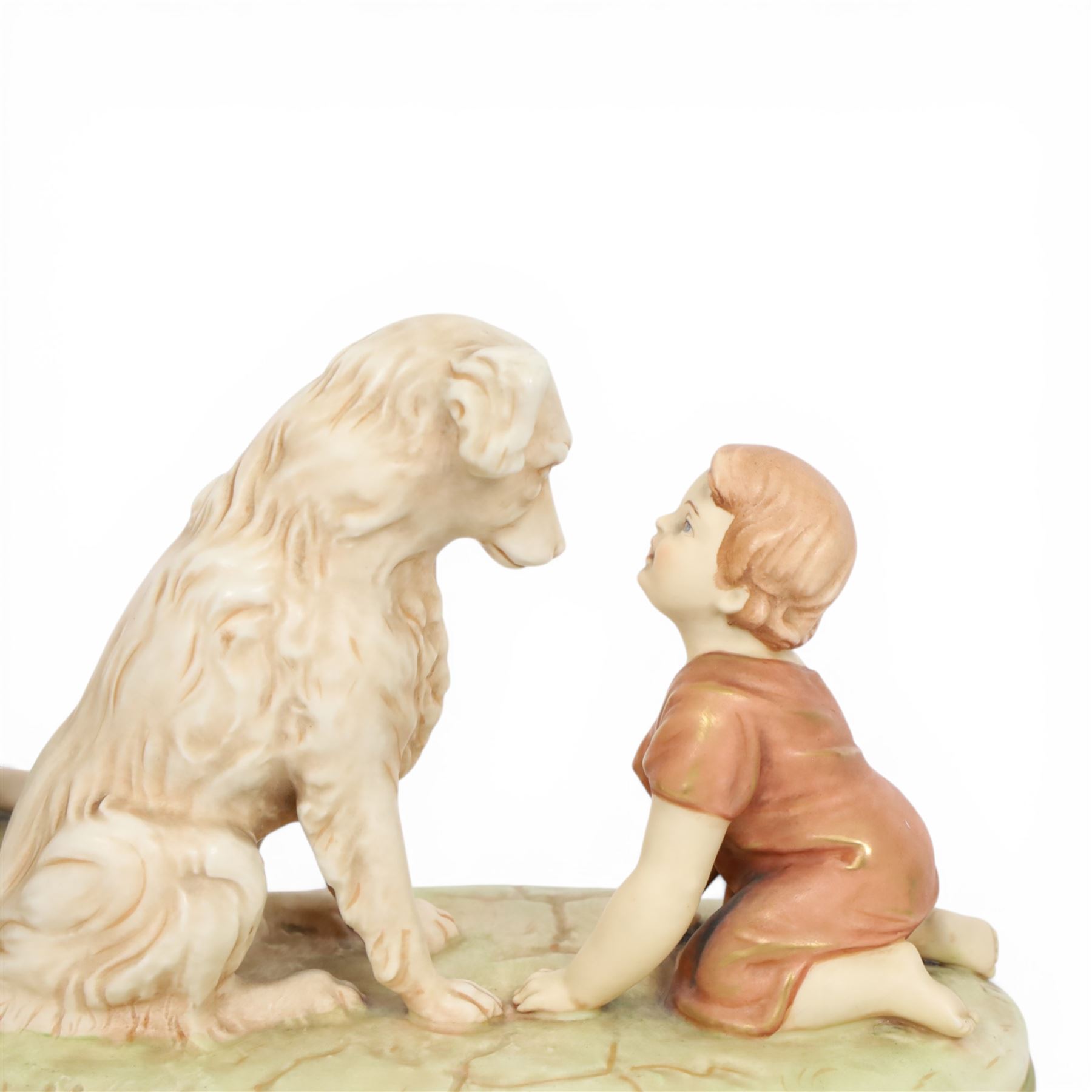Two Royal Dux figures, each modelled as a toddler and dog, upon oval base, one titled 'Can't you talk?', model no 2369, each with applied and impressed marks beneath, largest example H19cm