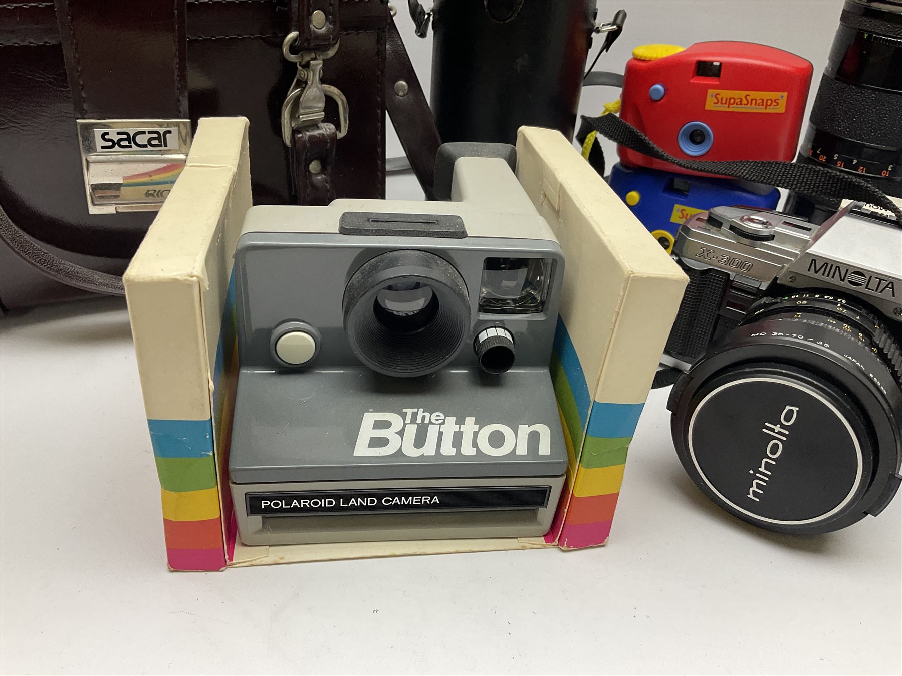 Vintage and later cameras and accessories including Minolta X-300 in carry bag, Tamron lens etc