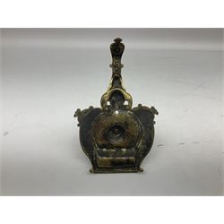 Collection of victorian and later brass desk accessories, to include a letter holder with cherub design, ink well of square form with hinged lid, brass table bell, brass casket with relief decoration, etc  