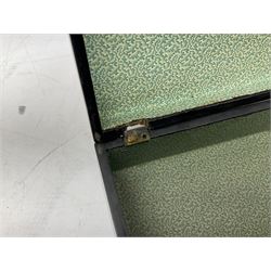  Late 19th / early 20th century Japanese lacquered table top cabinet, heavily decorated with mother of pearl inlay depicting blossoming branches, flowers and birds, the two hinged doors between longer drawers opening to reveal interior fitted with four short drawers, with lift up hinged canted lid, H28cm D9.5cm W23cm, together with mother of pearl inlaid miniature folding screen, dish decorated with walking figures with crimped edge, boxes decorated with flowers, birds and gilt etc