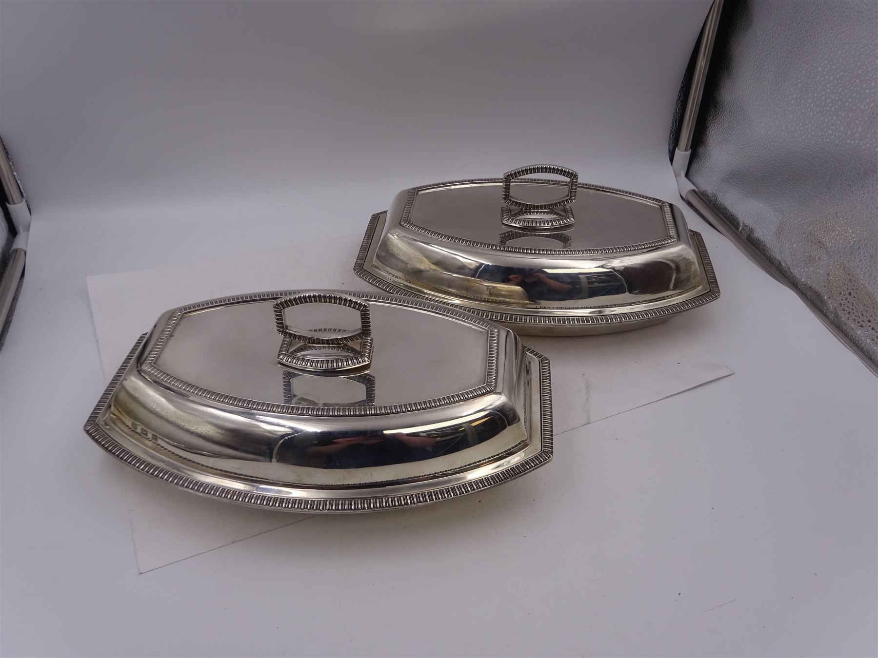 Pair of 1930s silver serving dishes with covers, each with removable handles, hallmarked Barker Brothers Silver Ltd, Birmingham 1935, L27.5cm, H12cm