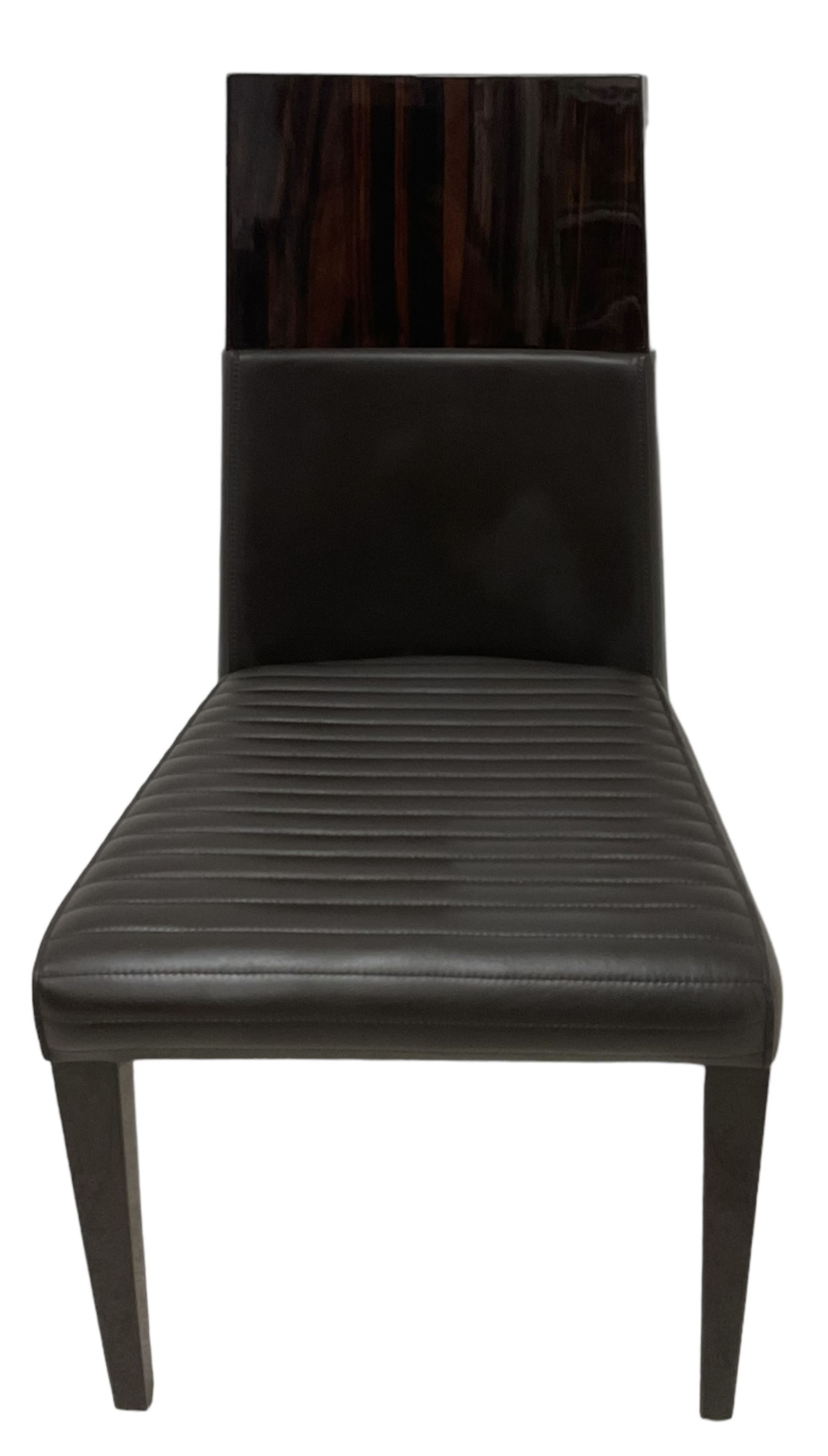 Giorgio Collection - Art Deco design macassar ebony 'Luna' extending dining table, oval top with quarter-matched veneer and stringing, raised on a curved V-shaped pedestal with oval base; with matching set of dining chairs, high macassar ebony back, the lower half and seat upholstered in black leather, on ebonised tapering supports, retailed by Harrods