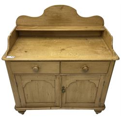Victorian polished pine washstand side cabinet, raised back with shelf, fitted with two drawers over panelled cupboard, on turned feet