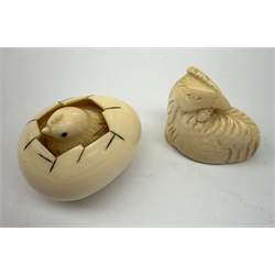 A Japanese ivory netsky modelled as a chick hatching from an egg, with marks beneath, together with a further netsky modelled as a seated chicken, also marked, a carved ivory cheroot holder, and two small carved ivory elephants, plus a Japanese stand modelled in the form of a crane, with character marks to base, a Japanese bamboo detailed teapot, cloisonne circular  pot, and an embroidered pouch and purse. 