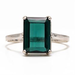 18ct white gold tourmaline ring, four claw set with an emerald cut green tourmaline of app...