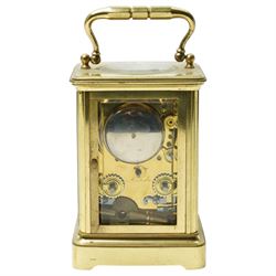 Early 20th century carriage clock, the white enamel dial inscribed F G Russell, Malvern with bell strike in brass and bevelled glass case H12cm