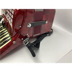 Hsinghai Studio piano accordion with red pearline finish, twenty keys and seventy-two buttons W44cm; in hard carrying case with additional The Music Room soft gig case