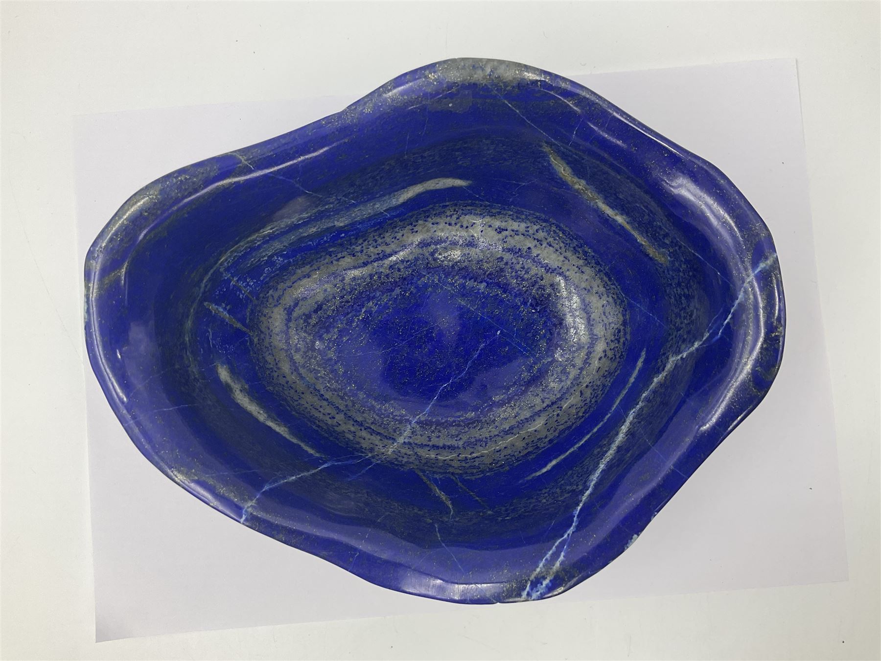 Carved bowl, flat-bottomed bowl carved from a single piece of Lapis lazuli with flared rim, H8cm, L21cm