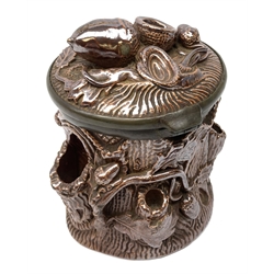 19th century salt glazed tobacco jar, of cylindrical form modelled as a tree trunk, decorated in relief with applied oak leaves and acorns, the hinged pewter mounted cover with acorn finial, H17cm   