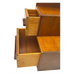 Early 20th century Art Deco walnut dressing table, featuring a large oval triptych mirror above a stepped base, fitted with four drawers and a central glass shelf, all raised on a plinth base