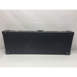 Copy of a Fender Stratocaster electric guitar in black with Wilkinson bridge, lock-in tuners, synchronised tremolo and various patent numbers; L99cm; in hard carrying case with strap and digital tuner