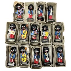 Fourteen Robertson's 'hand painted pottery' advertising figures of musicians, twelve in original delivery boxes and two in part boxes (14)