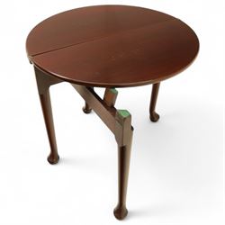 20th-century Georgian Revival style double fold-over card table, the first hinged circular top with polished mahogany surface above a second hinged circular top revealing a green baize playing surface with four counter-wells, underneath with a recessed compartment with and  chip and dice wells, the apron with fitted lock and key, raised on slender straight legs with pad feet 