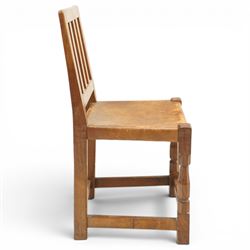Mouseman - 1940s oak side chair, the slat-back over a slung leather seat, raised on octagonal front supports united by box stretcher, carved with slim mouse signature, by the workshop of Robert Thompson of Kilburn