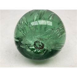 Four Victorian and later green glass dump paperweights with with air bubble inclusions, largest example H17cm