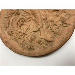Pair of 19th century classical terracotta relief wall plaques depicting the goddess Hygeia and another goddess, seated holding an ewer, each of oval form, indistinctly signed, each stamped Ferreira verso, H42cm, W30cm