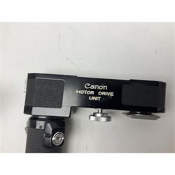 Collection of Canon lenses, to include 'Canon Lens FD 100mm 1:2.8', serial no 12821, 'Canon Lens FD 200mm 1:4' serial no 245313, 'Macro Canon Lens FL 50mm 1:3.5', serial no. 25505, 'Canon Lens FD 135mm 1:3.5 etc, together with other Canon equipment, including Bellows FL, Slide Duplicator etc 