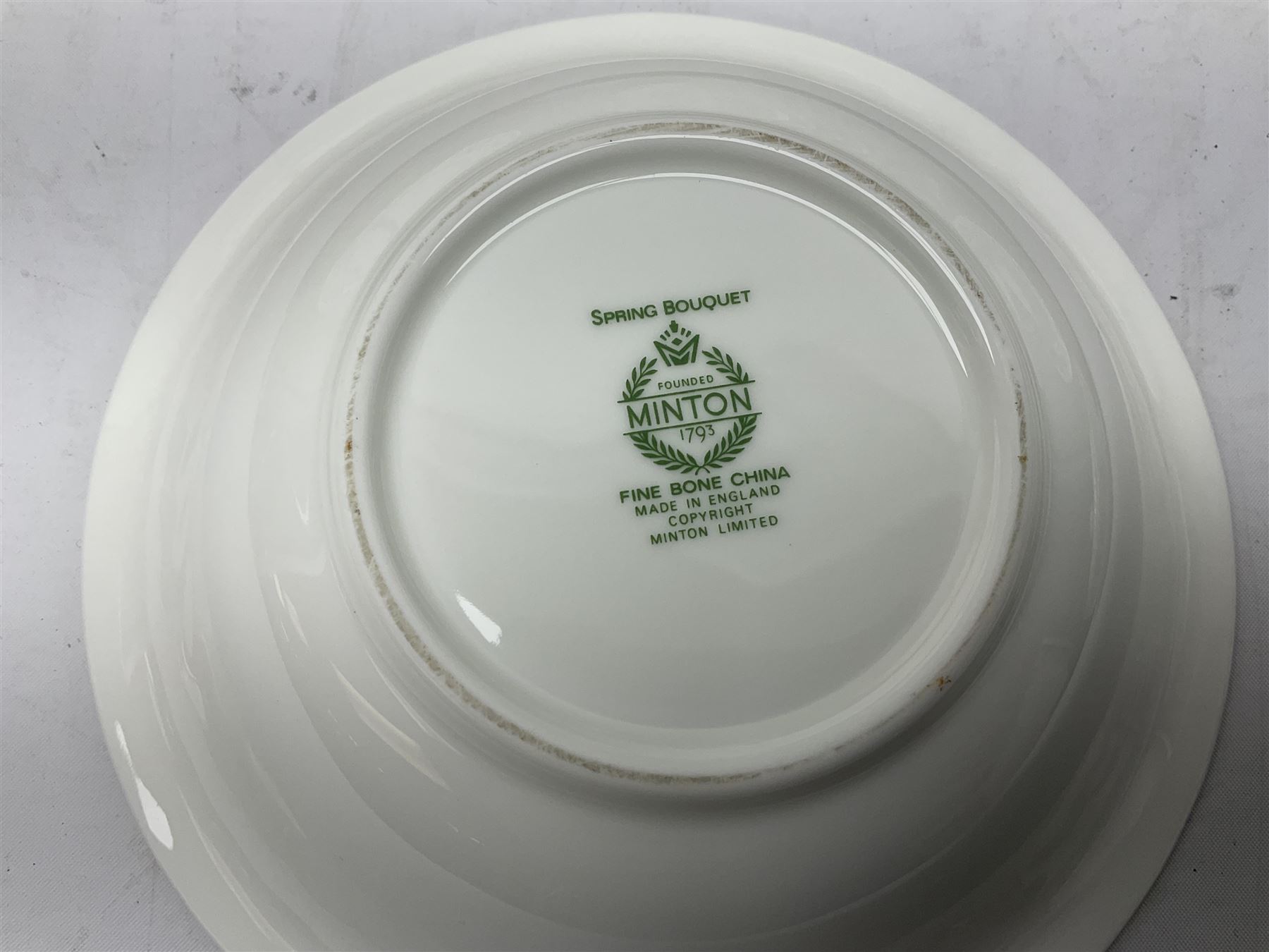 Minton Spring Bouquet pattern dinner and tea service, comprising dinner plates, twin handled tureens with covers, meat platter, teapot, milk jug, sugar bowl with cover, tea cups and saucers, bowls, cake plate, side plates, dessert plates, etc all with printed mark beneath (82)