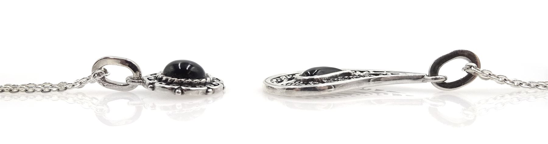 Silver contemporary triangular Whitby jet pendant necklace, two other silver Whitby jet necklaces; one round and one in a paisley shape, and two pairs of Whitby jet earrings; matching paisley shape and the other pair cushion triangle shaped, all stamped 925