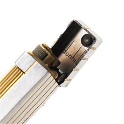 Dunhill - Rollagas lighter, silver-tone metal with gilt linear decoration and gilt ribbed thumbpiece, H6.5cm 