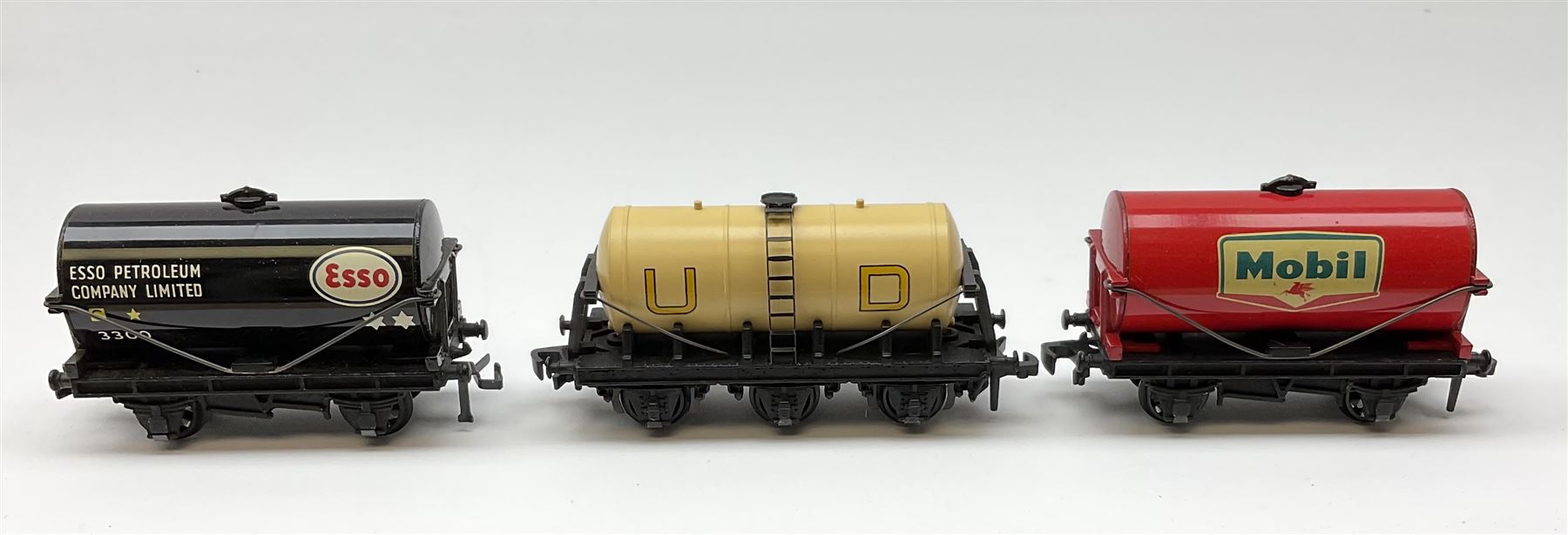 Hornby Dublo - 4646 Low-Sided Wagon D1 with cable drums; 4649 Low-Sided Wagon with tractor; 4656 16-Ton Mineral Wagon brown; 4657 United Dairies Milk Tank Wagon; 4660 U.G.B. Sand Wagon; 4677 Tank Wagon 'Mobil' (D1); and 4680 Tank Wagon 'Esso' (Fuel Oil); all boxed (7)