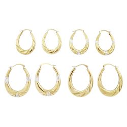 Four pairs of silver-gilt hoop earrings