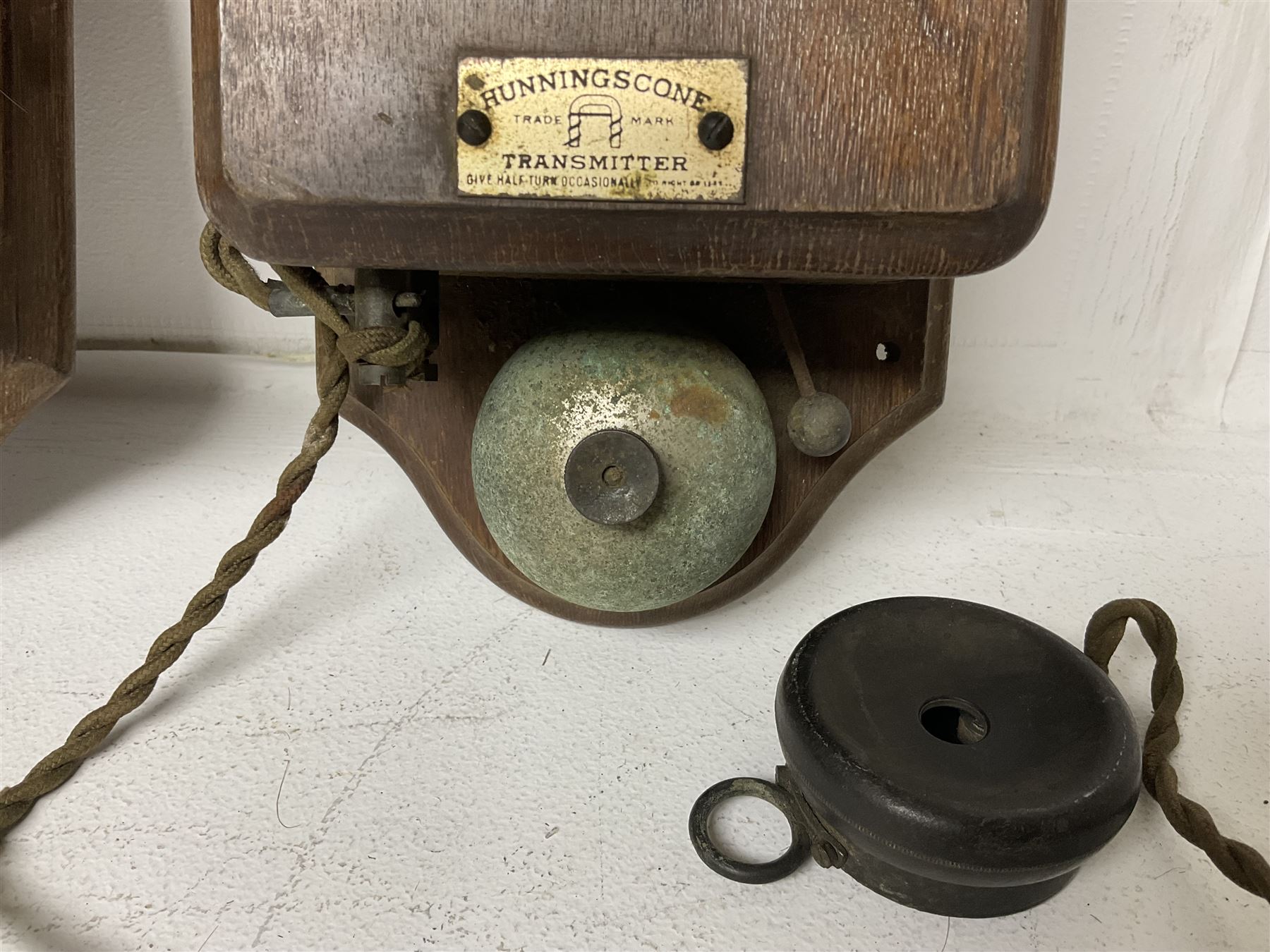 Two Hunningscone patent wall mounting telephones in walnut casing, together with Sterling Telephone & Electric Co. Ltd early wall-mounted telephone 'Primax' and one other 