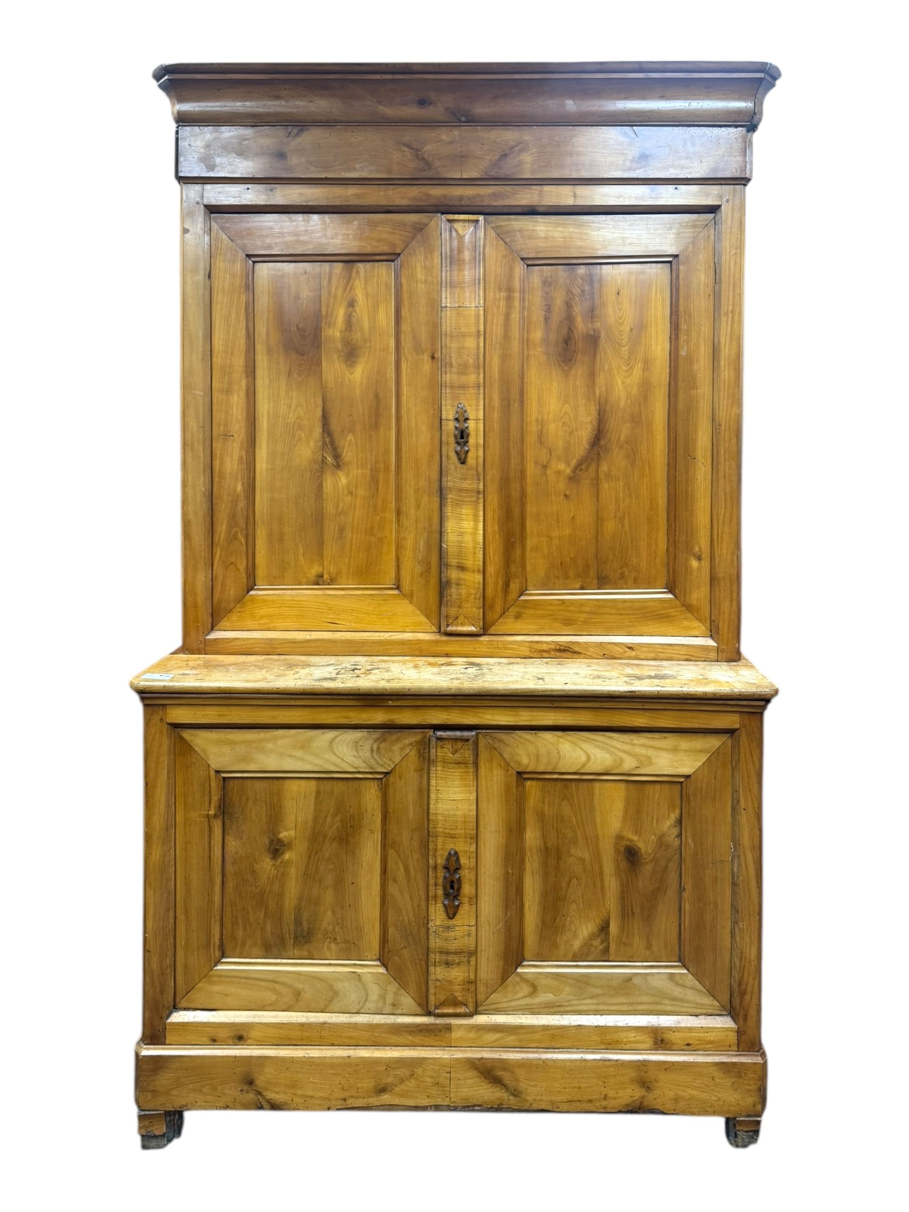 19th century French walnut dresser, the moulded cornice over two-panelled cupboard doors, enclosing two shelves and one small
drawer, on a base of two further cupboards