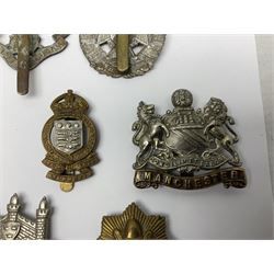 Twenty cap badges including Hertfordshire, Royal Sussex, Cambridgeshire, Hampshire, Notts and Derby, East Surrey, Herefordshire, South Lancashire, Devonshire, Bedfordshire, Durham Light Infantry etc (20)